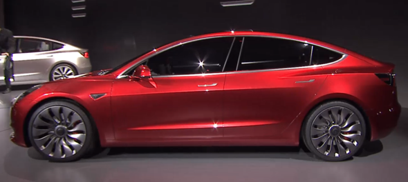 Red Tesla Drivers Side