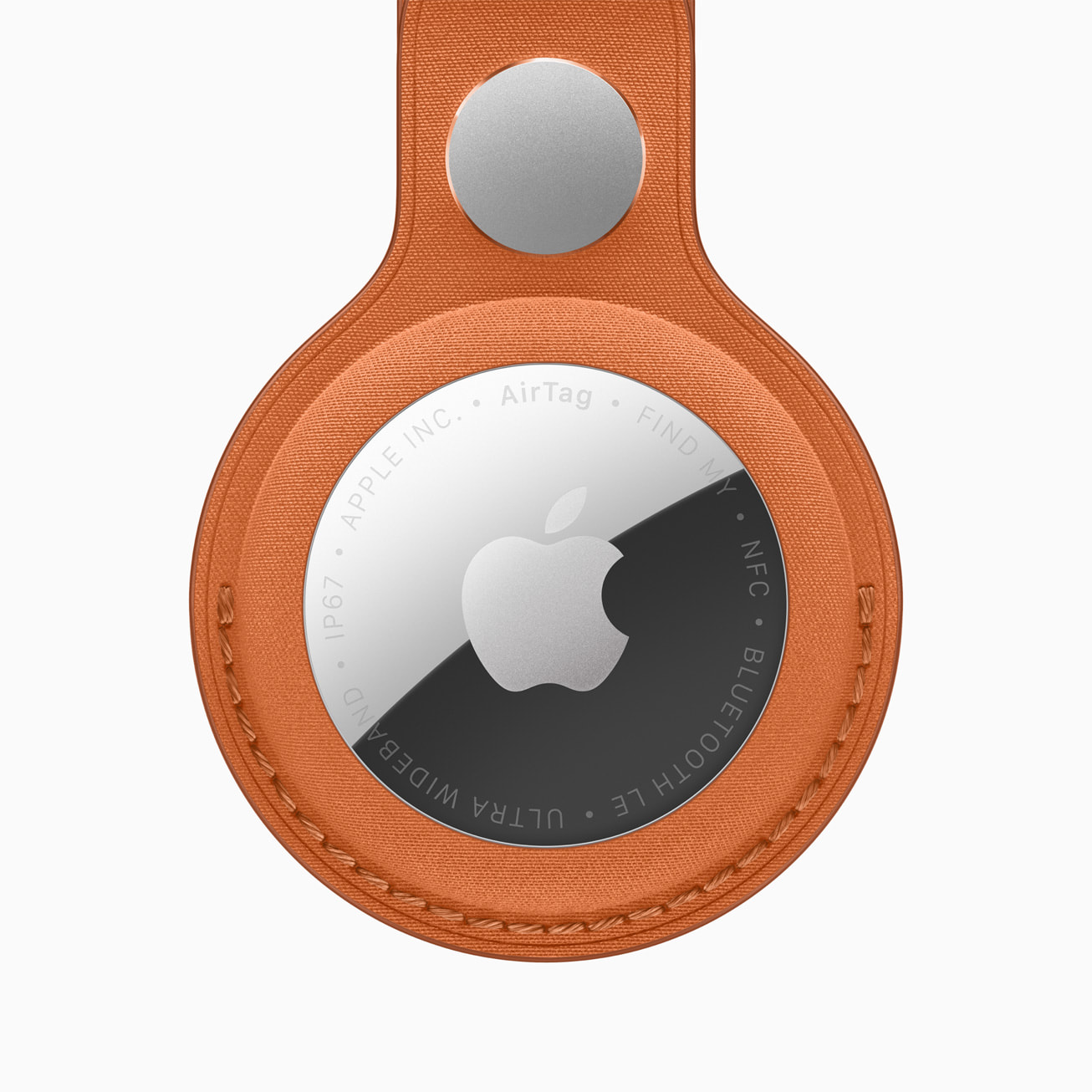 Close-up of Apple AirTag 2nd gen attached to a FineWoven key ring