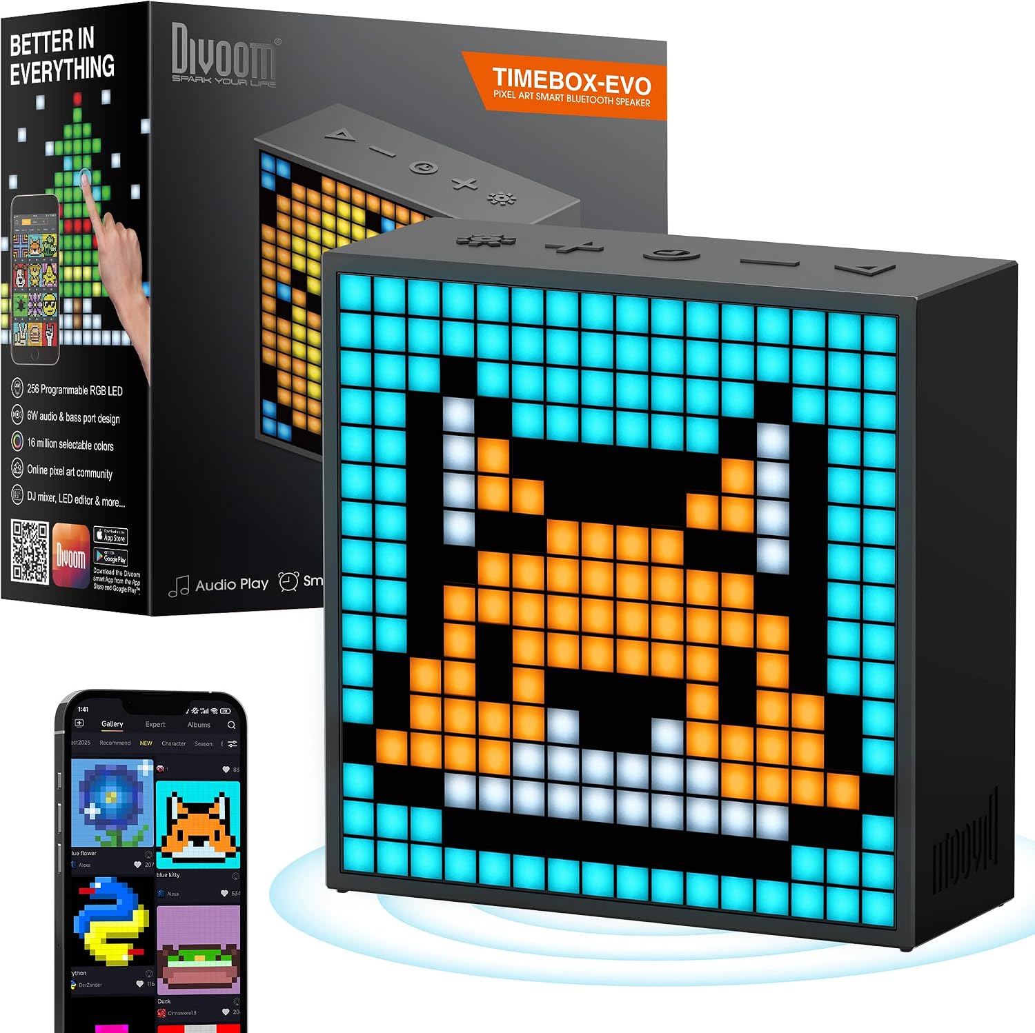 Divoom TimeBox Evo black pixel-art Bluetooth speaker cube showing a custom LED smirk on a gaming desk