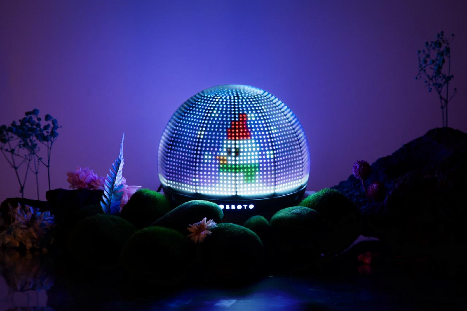 OBBOTO Sphere Desktop Buddy glowing with pixel emoji on a desk