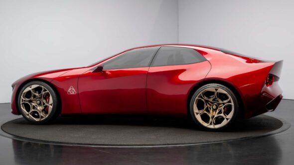 Red Alfa Romeo Cuorerosso concept fastback in side profile on a turntable in the studio