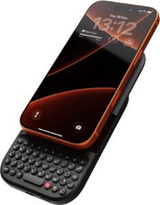 Clicks Power Keyboard slid out under an iPhone with an orange case