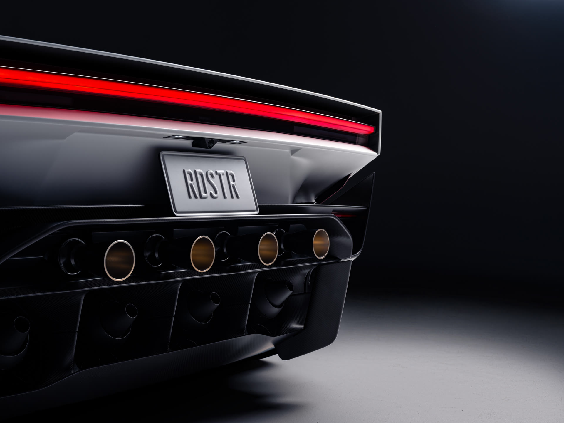 Rear of the new Tesla Roadster showing its row of thruster nozzles