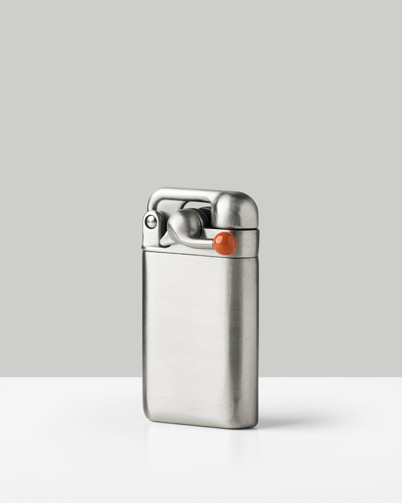 Closed Craighill Swingtop lighter in brushed stainless steel standing upright
