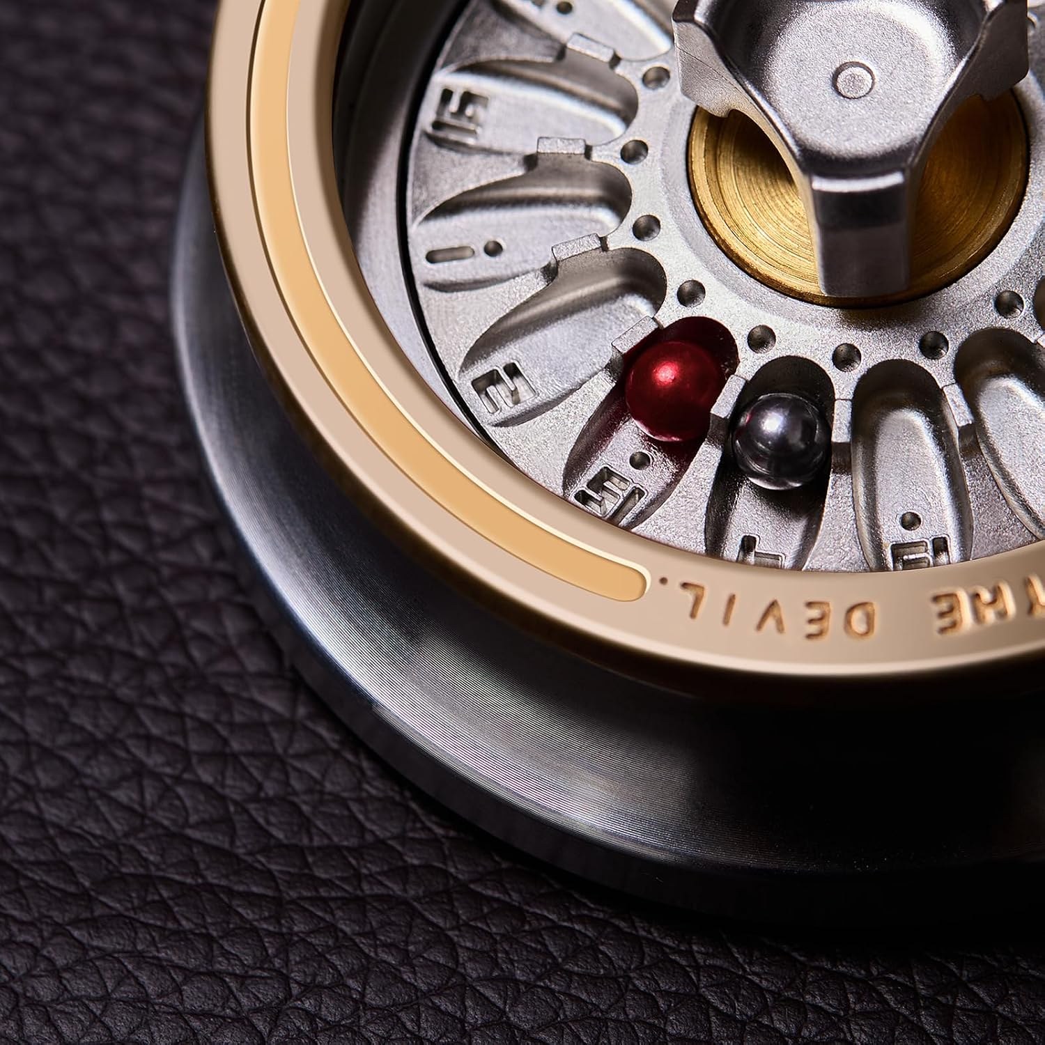 Close-up of the Hammersmith Carnival Roulette wheel with numbered pockets and steel balls