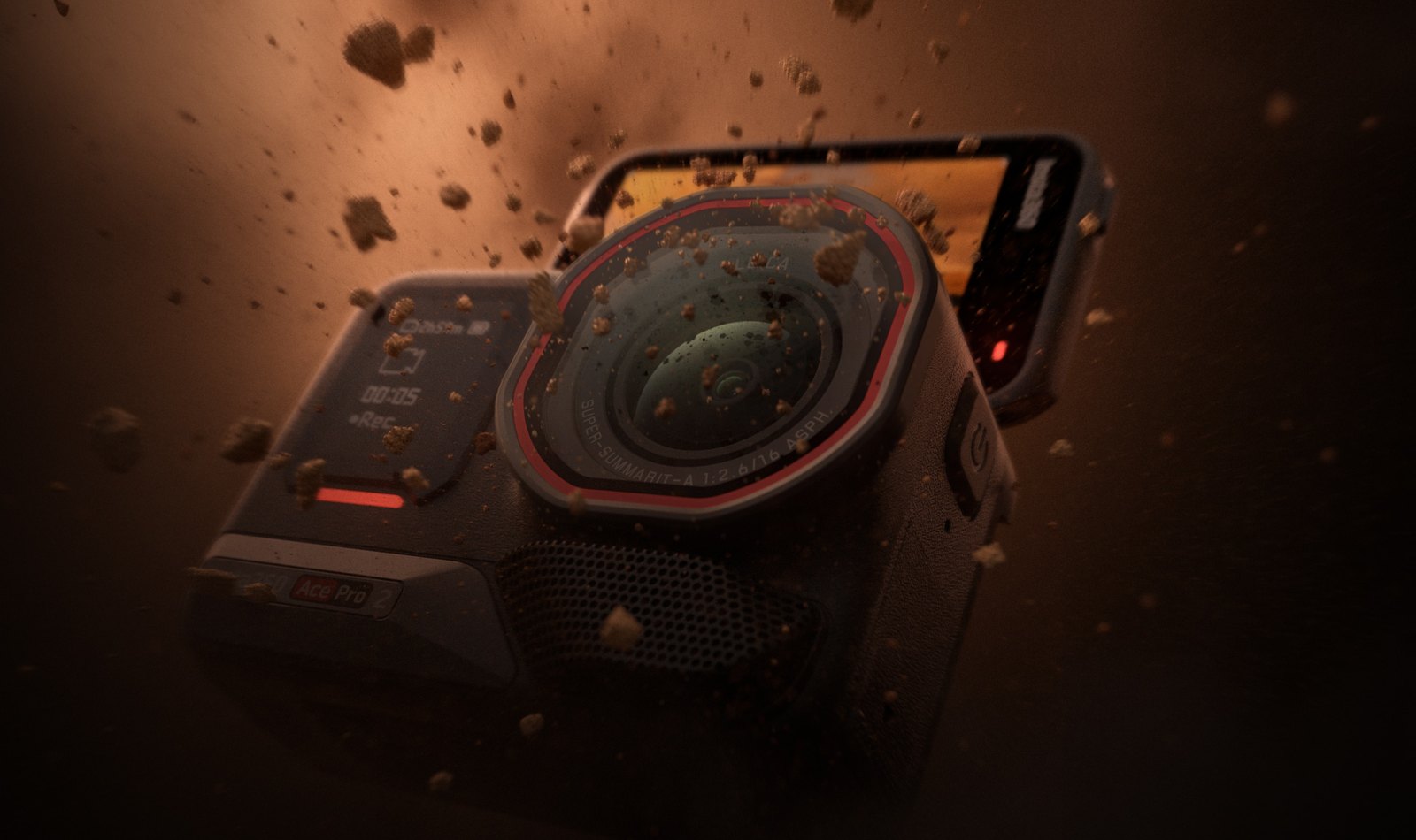 Close-up of the Insta360 Ace Pro 2 with its flip screen raised as dirt and debris fly around the Leica lens