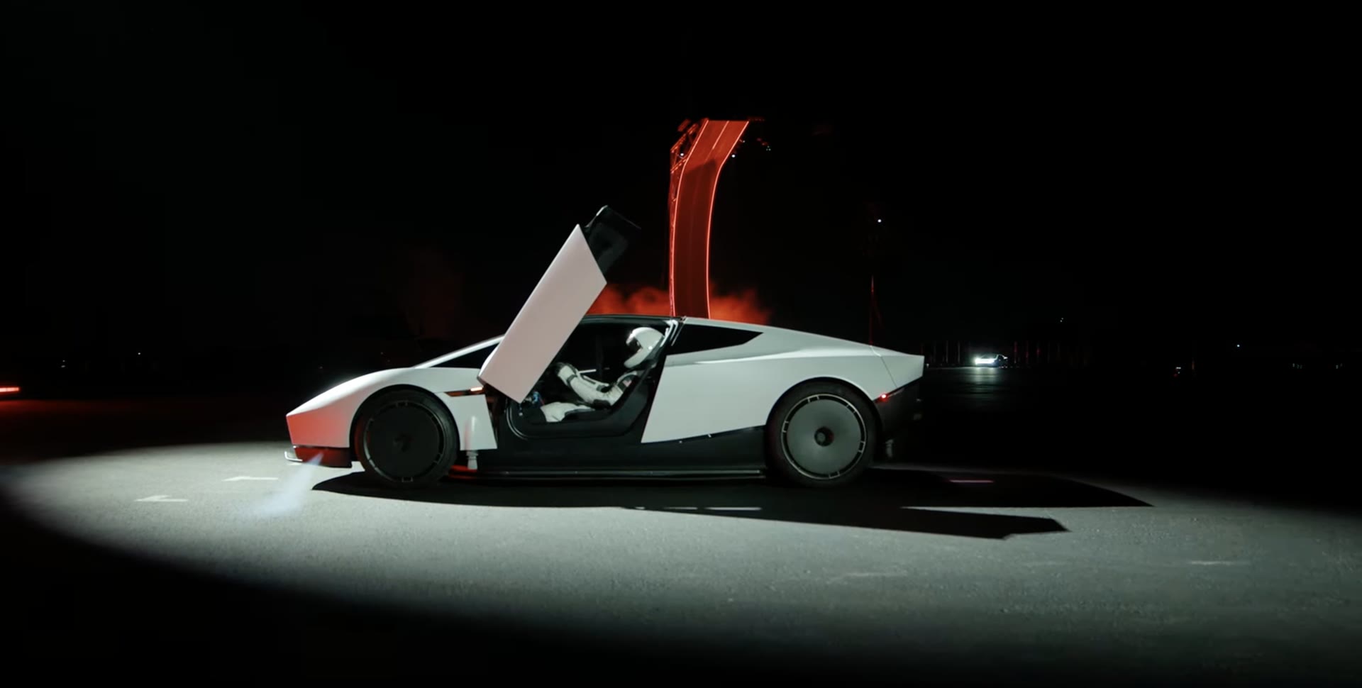 New Tesla Roadster with its door open at the night reveal event