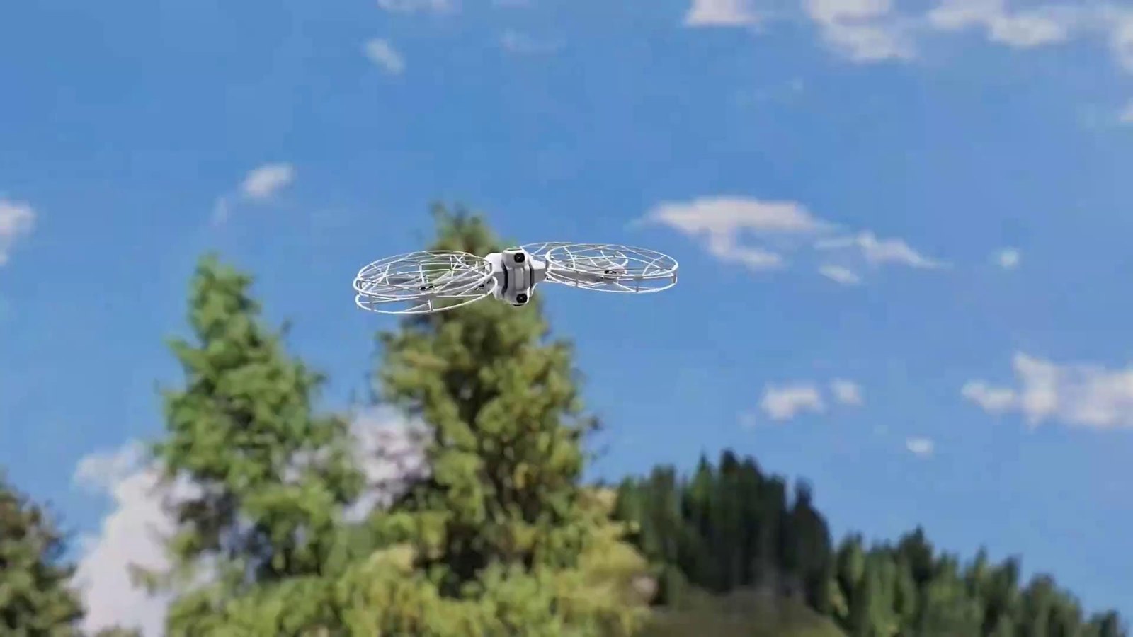 Antigravity A1 drone with full-coverage propeller guards flying over pine trees