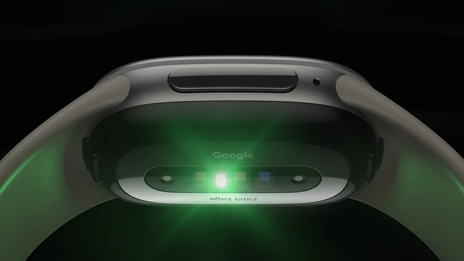 Underside of the Fitbit Edge glowing green from its heart rate sensors