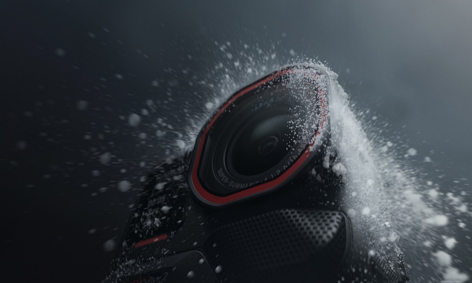 Insta360 Ace Pro 2 lens getting blasted with a spray of snow and water against a dark background