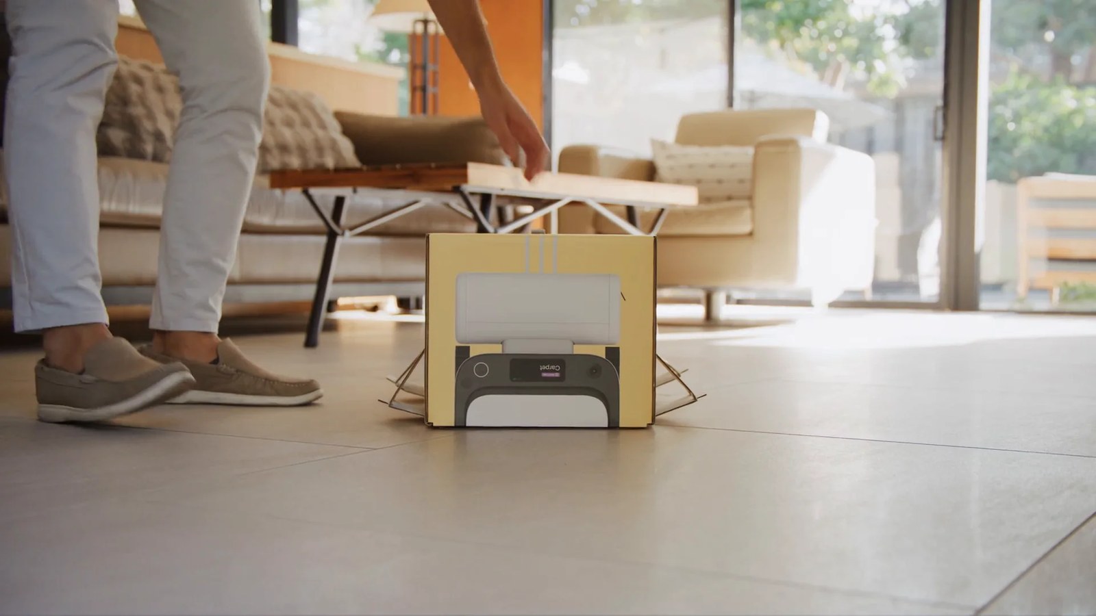 Matic robot vacuum being unboxed on a tile living room floor