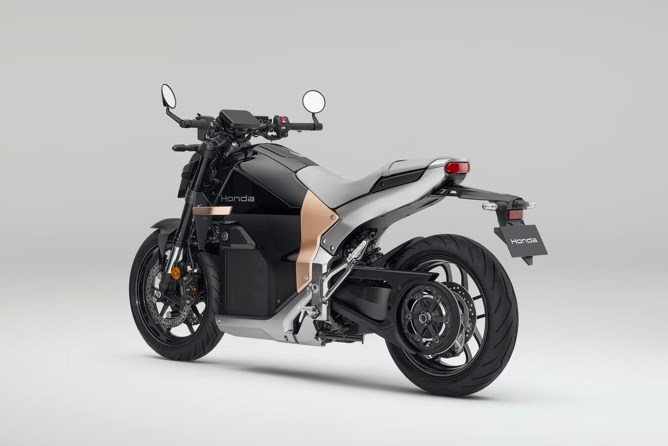 Rear three-quarter view of the Honda WN7 showing its single-sided swingarm and exposed rear wheel hub
