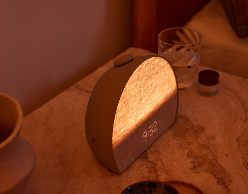 Hatch Sleep Clock in Greige showing the time on a marble nightstand