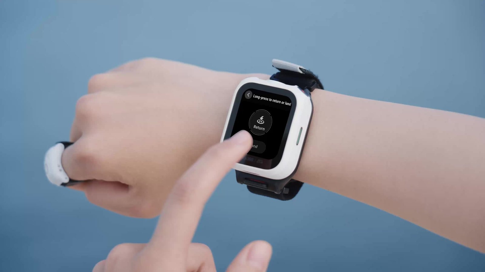Finger swiping the Antigravity Watch Remote screen to steer the drone