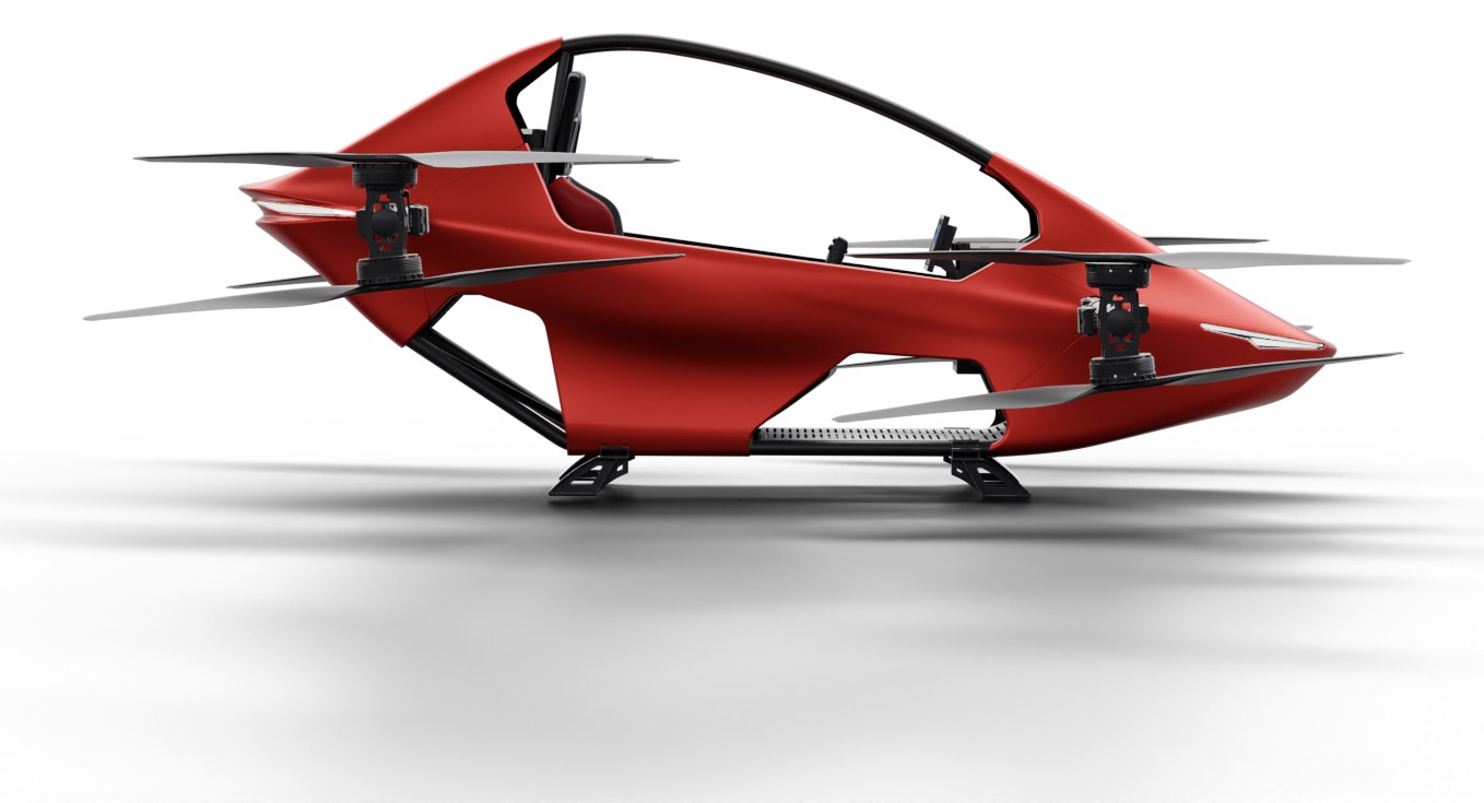 Side view render of a red YIVTOL S-Zero showing its low cockpit, landing skids and rotor arms