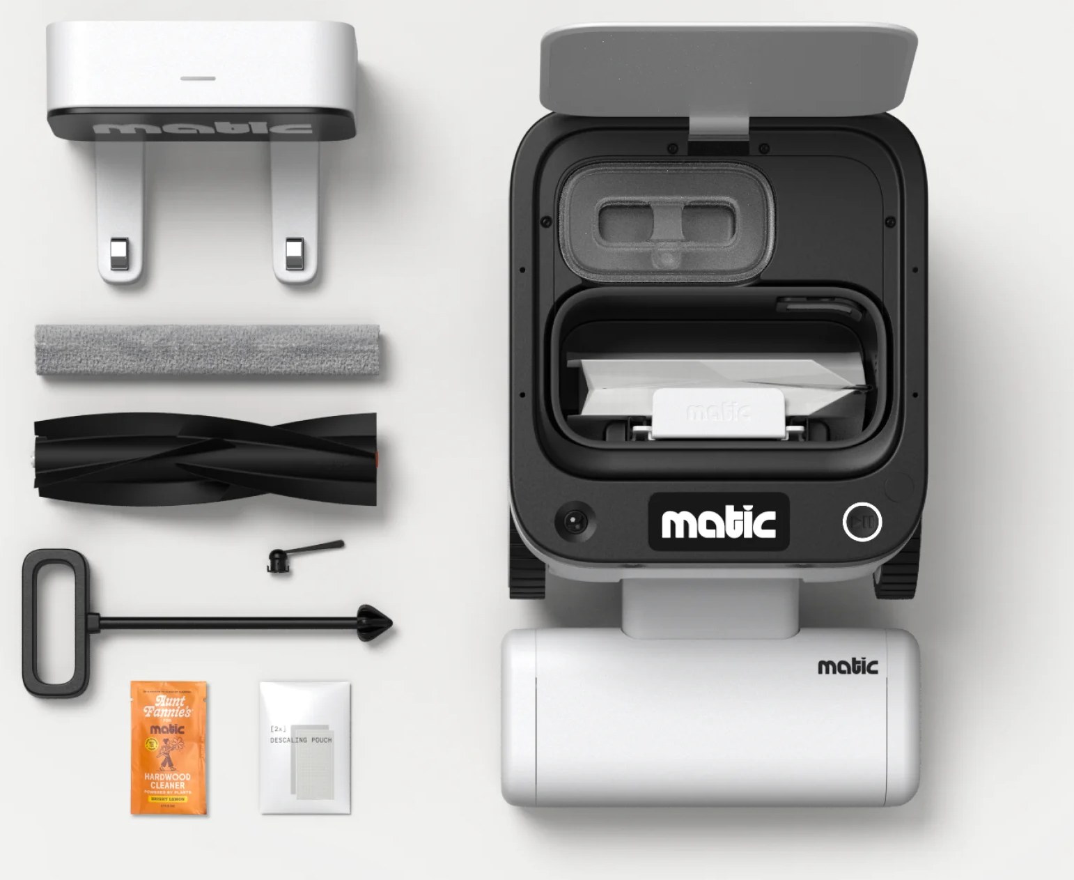 Matic robot, dock, HEPA bags, brush and mop rolls laid out
