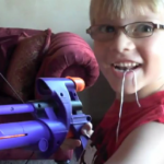 kid pulls tooth with nerf gun